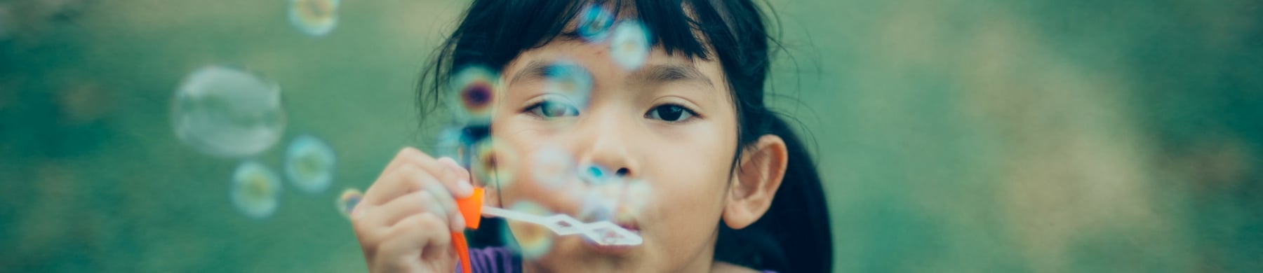 Girl blowing bubbles